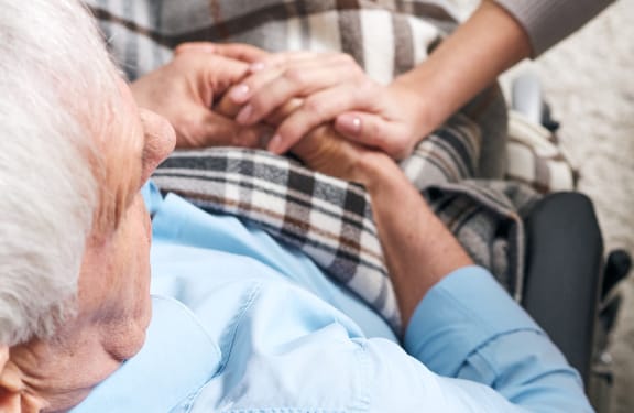 Older man sitting in a wheelchair